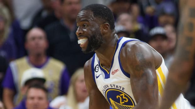 Draymond Green reacts incredulously after being called for a foul for stomping on Damontas Sabonis
